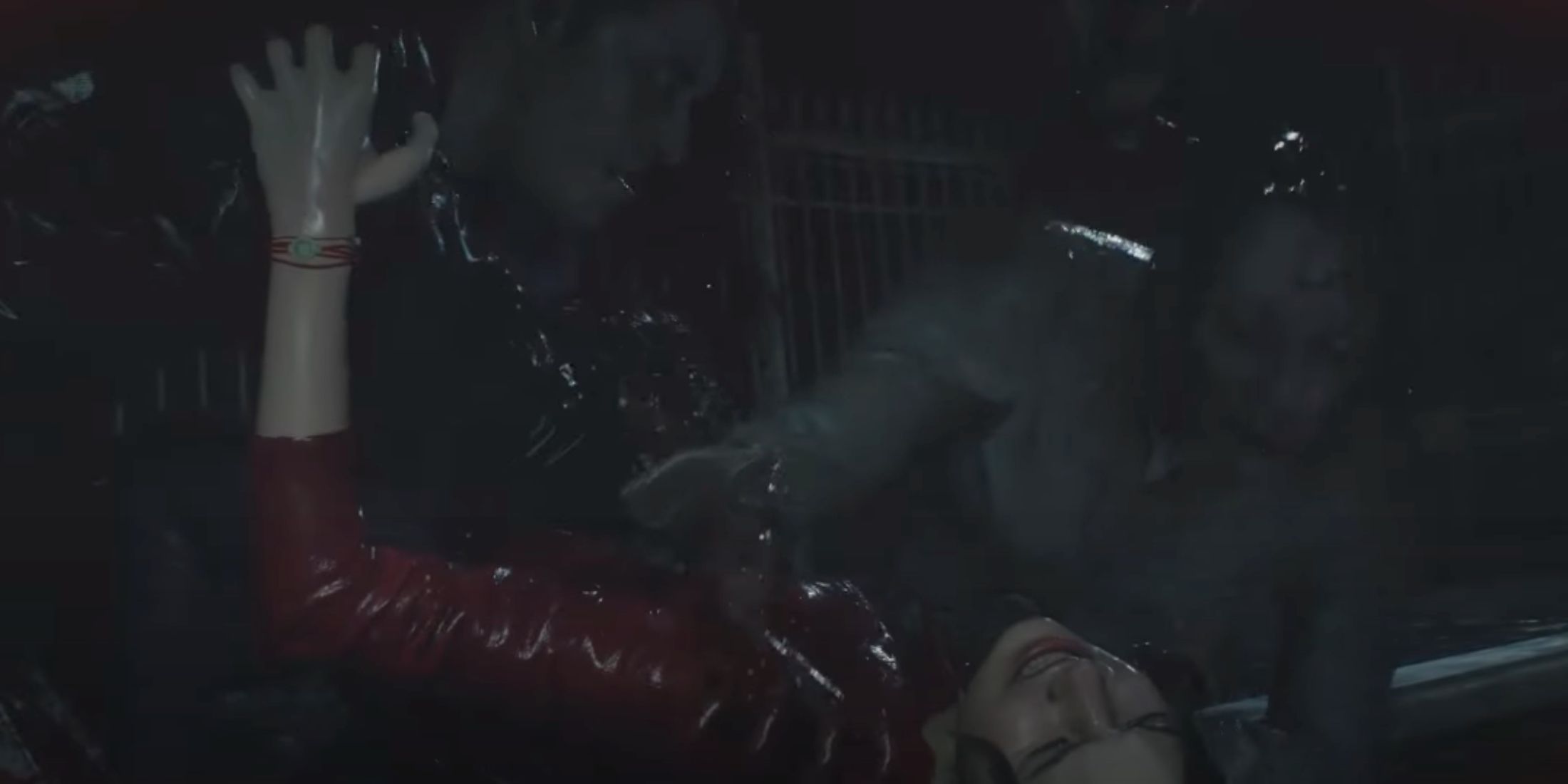 Claire lying on the ground with a zombie on top of her