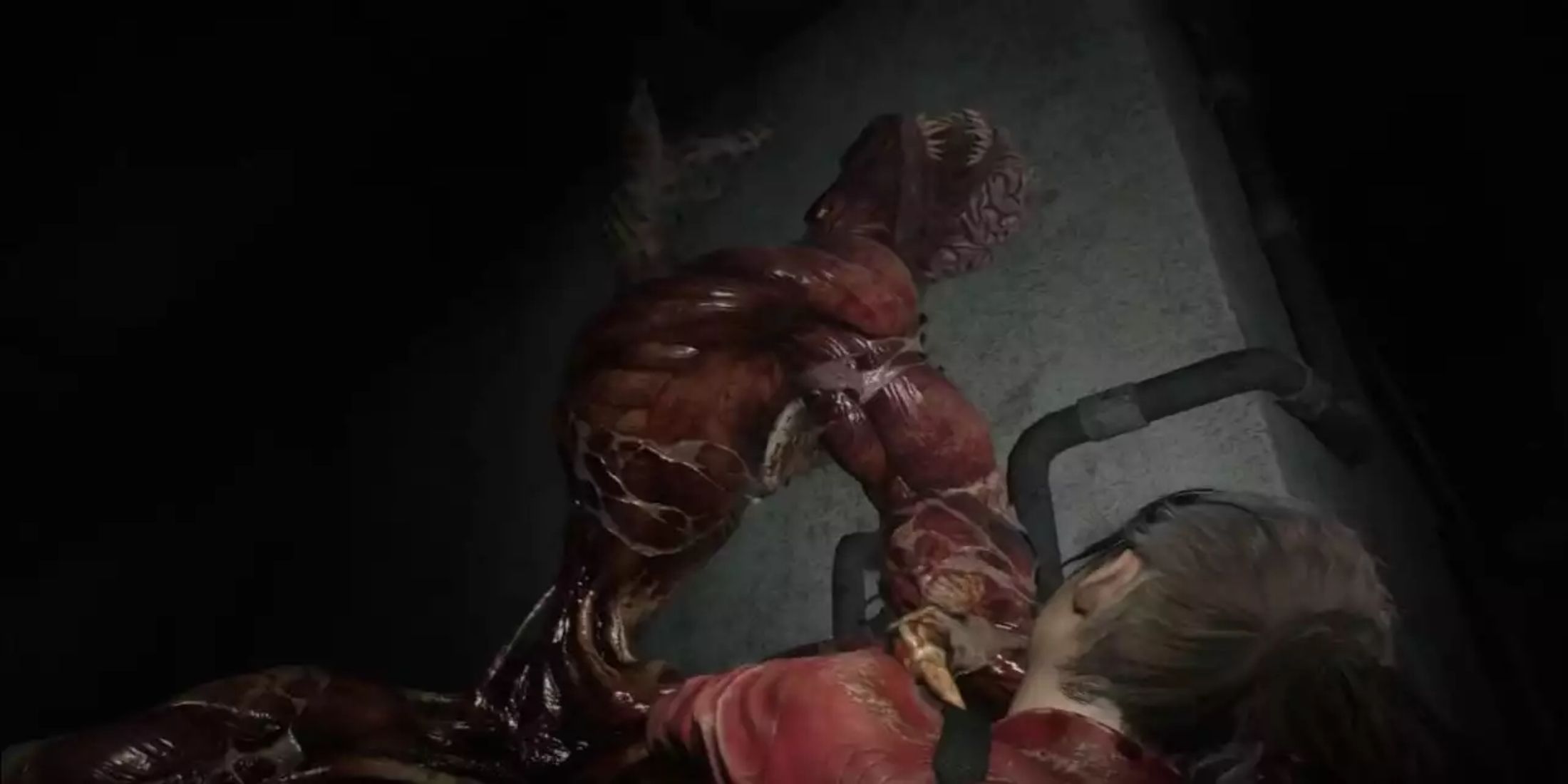 Claire Redfield being attacked by a Licker in Resident Evil 2