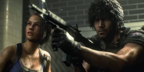 Carlos aiming a machine gun with Jill beside him in Resident Evil 3 Remake