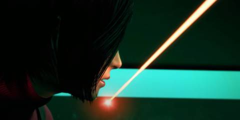 Ada Wong pausing with her face inches from a laser