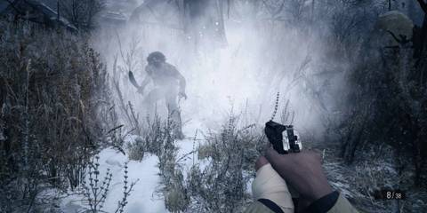 Ethan attacking a werewolf villager in a snowy terrain in Resident Evil Village