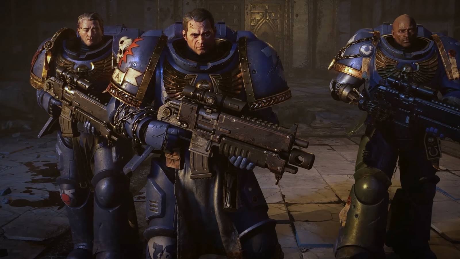 Three Space Marine 2 Ultramarines stand holding weapons.