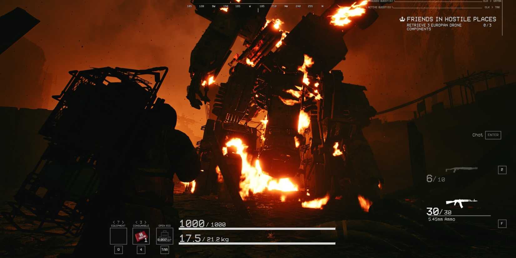 The player creeping up on a giant mech on fire