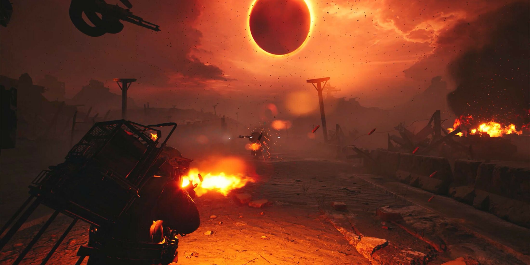 A man with a gun shooting at a robot enemy under a bright orange sun in a wasteland