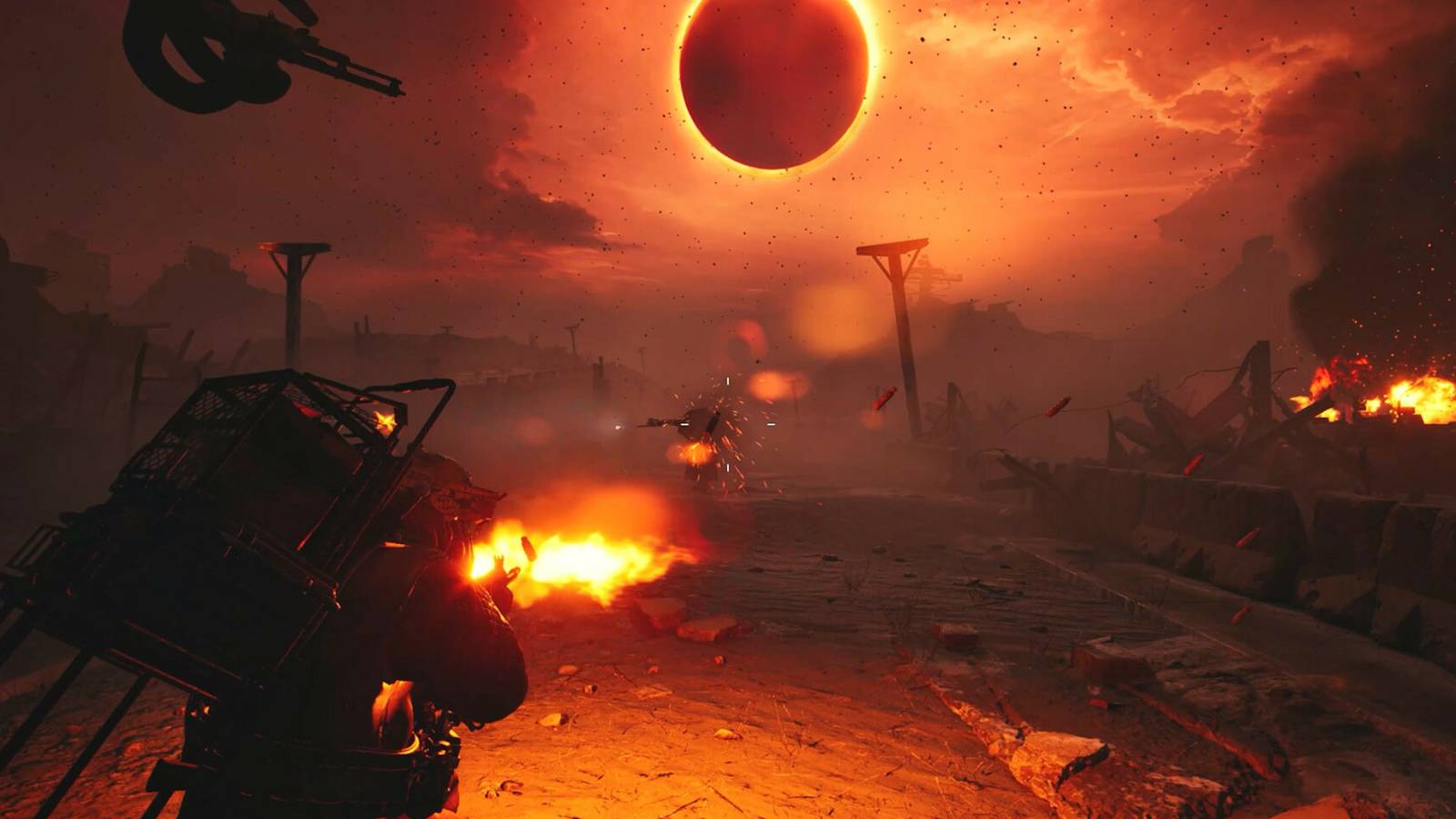 A man with a gun shooting at a robot enemy under a bright orange sun in a wasteland