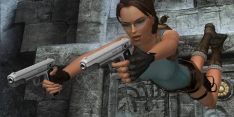 Lara Croft diving forward with her dual pistols