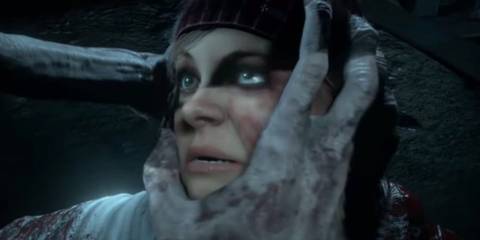 Ashley's face being grabbed by the Wendigo