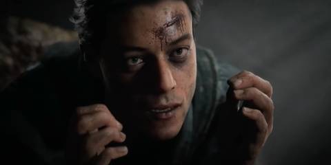 Josh staring up with a cut across his forehead