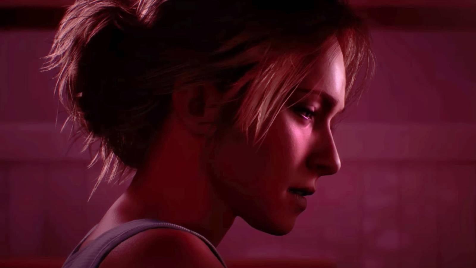 Until Dawn - Samantha Giddings staring off to the right with a red tint on the screen