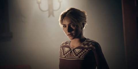 Samantha in her prologue outfit staring at the camera