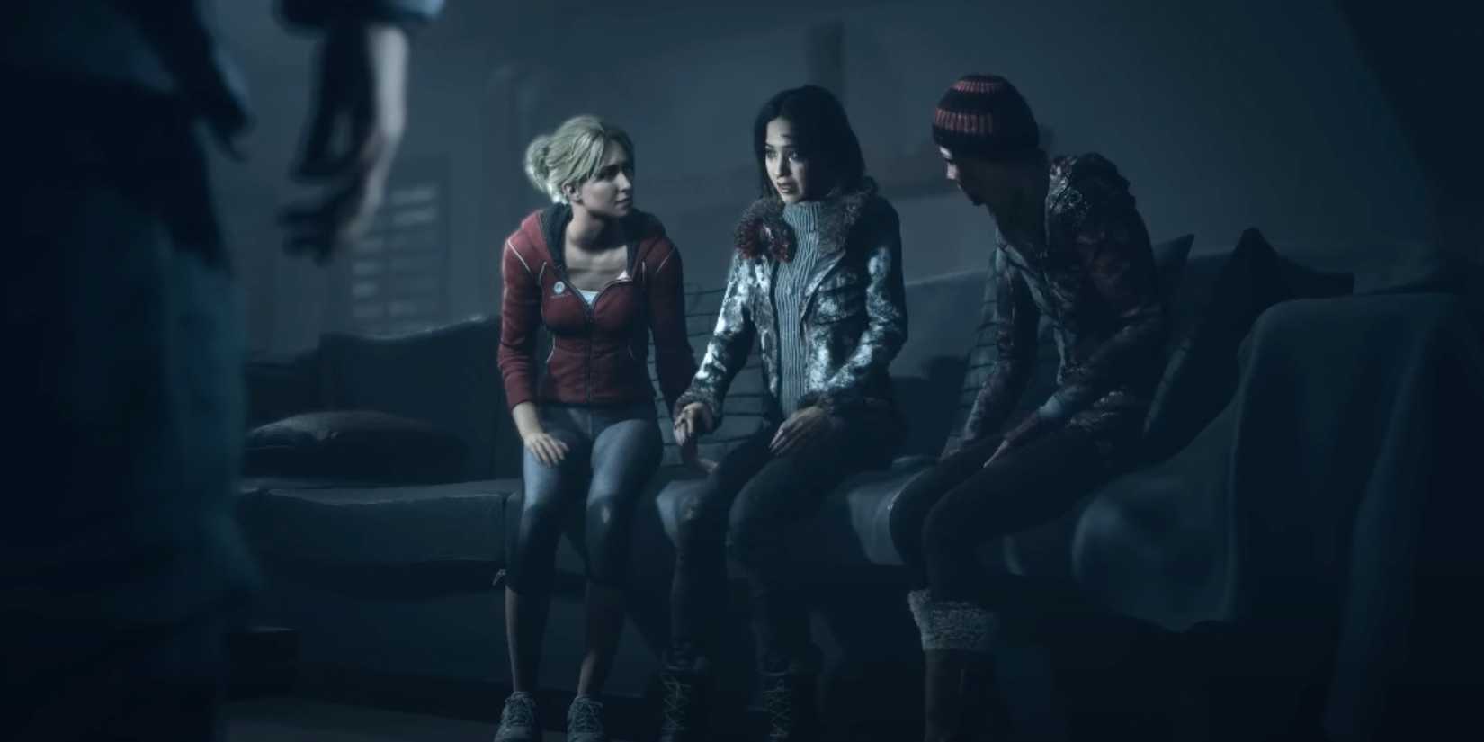 Emily speaking to Sam, Emily, Ashley, and Chris in the lodge