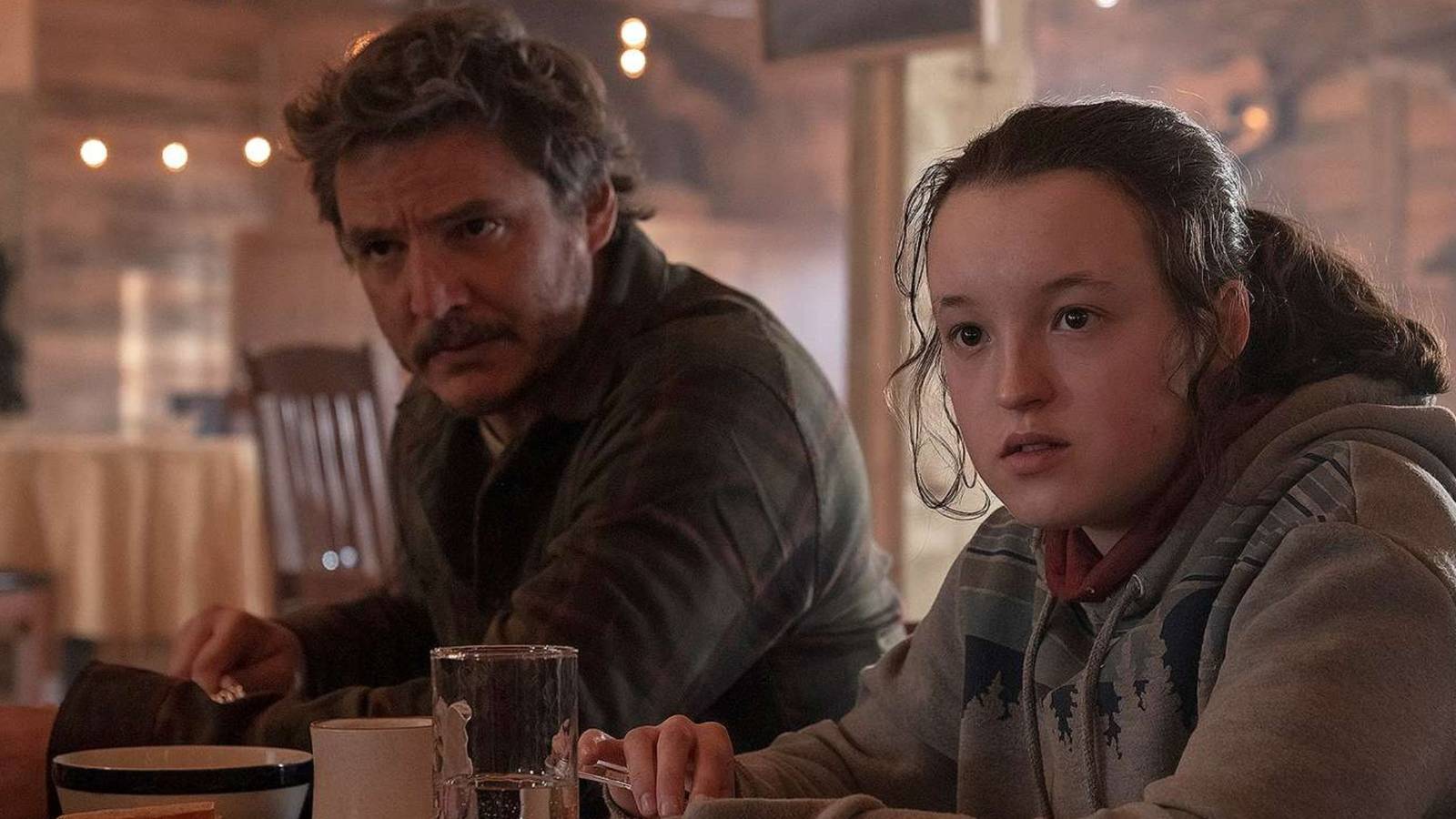joel and ellie eating breaking together in hbo's the last of us