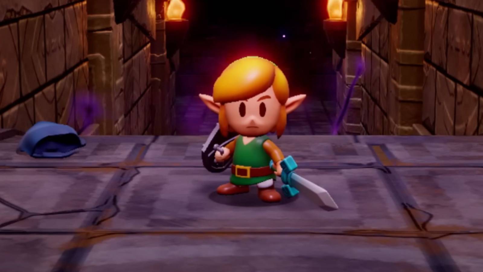 link standing at the top of steps with shield and sword in zelda: echoes of wisdom