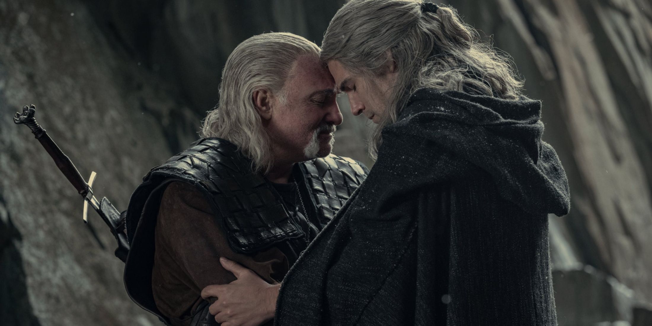 Geralt and Vesemir embracing each other in The Witcher season 3