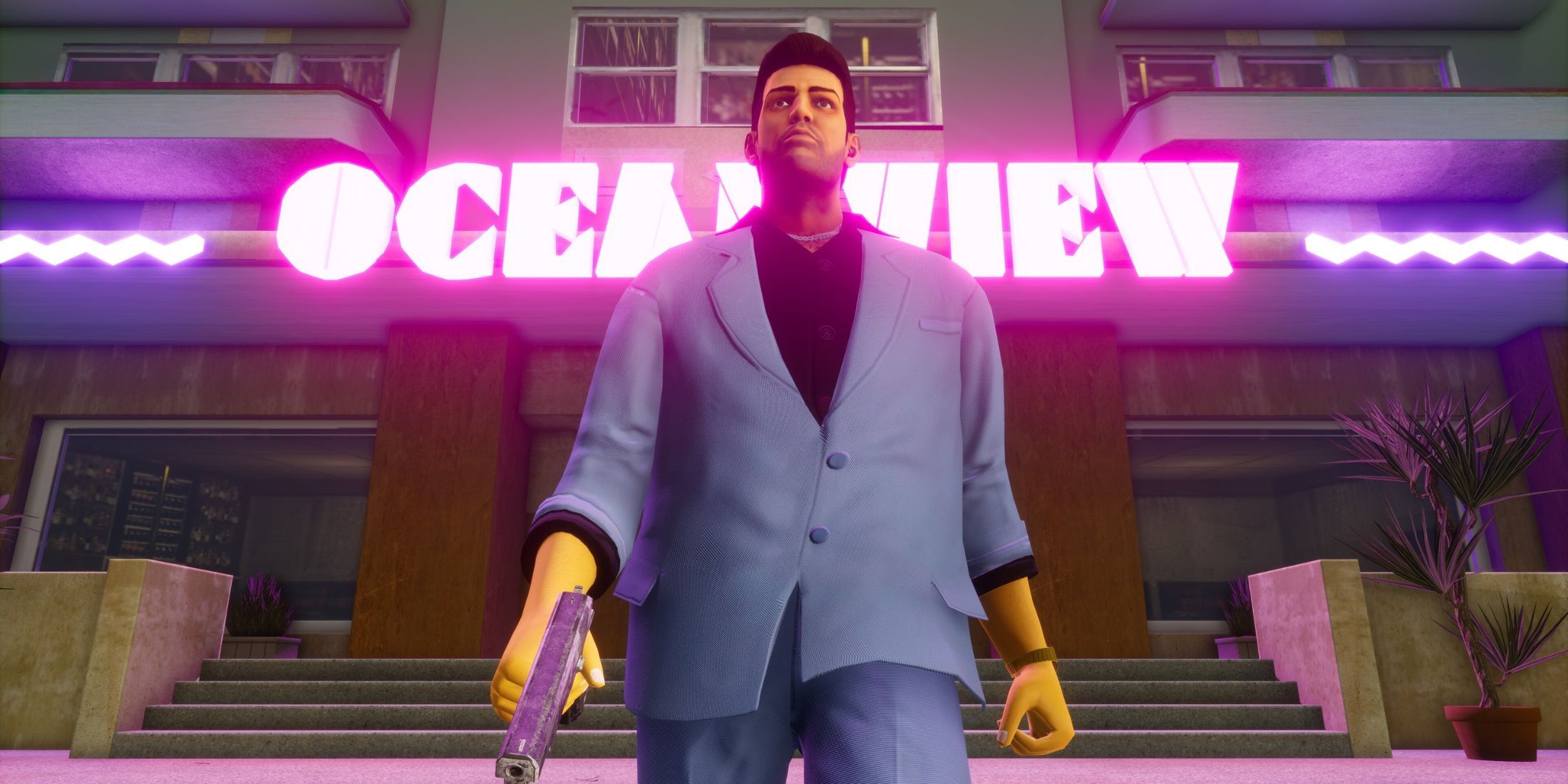 Tommy Vercetti walking out of the oceanview hotel with a pistol in his hand in Grand Theft Auto: Vice City