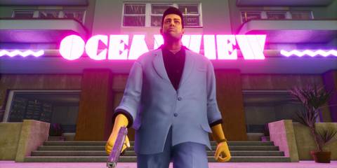 Tommy Vercetti walking out of the oceanview hotel with a pistol in his hand in Grand Theft Auto: Vice City