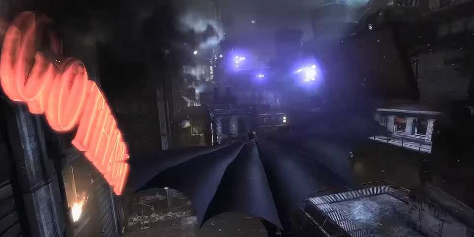 Batman soaring through the city in Batman: Arkham City