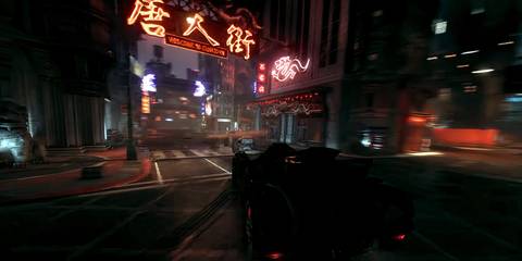 the batmobile driving through gotham