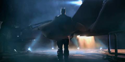 batman approaching the bat plane