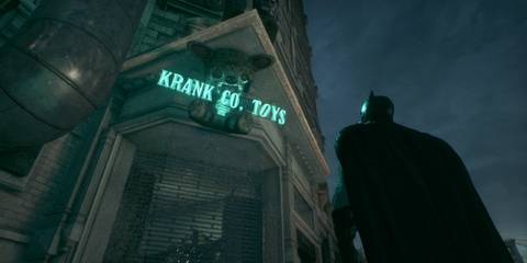 Batman standing outside the Krank Co. Toys company in Batman: Arkham Knight