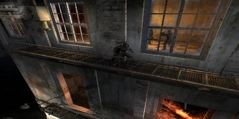 batman wakling on a fire escape