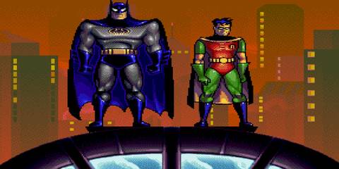 batman and robin standing on a roof