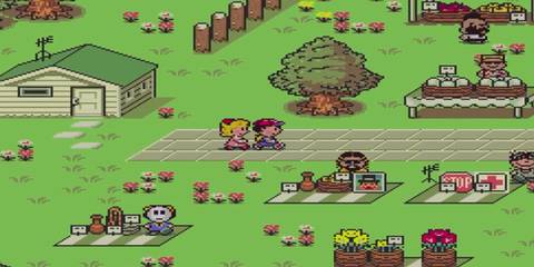 ness and paula walking through a town