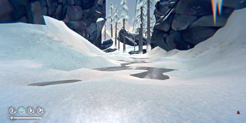 A winter landscape with cliffside and puddles of water