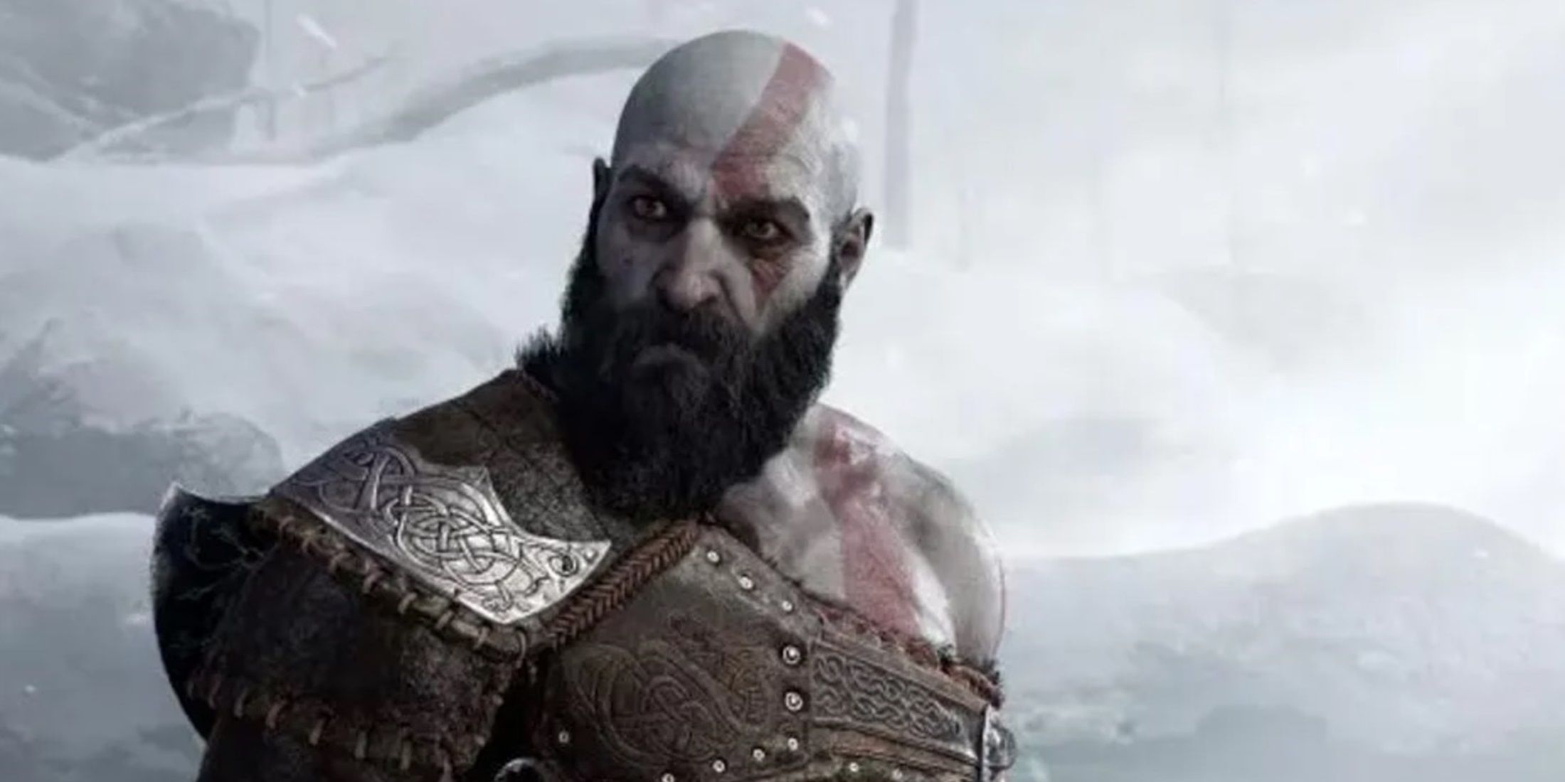 Kratos in snowy terrain, looking fierce and battle-ready