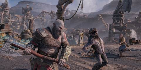 Kratos battling a creature with Atreus assisting in the background