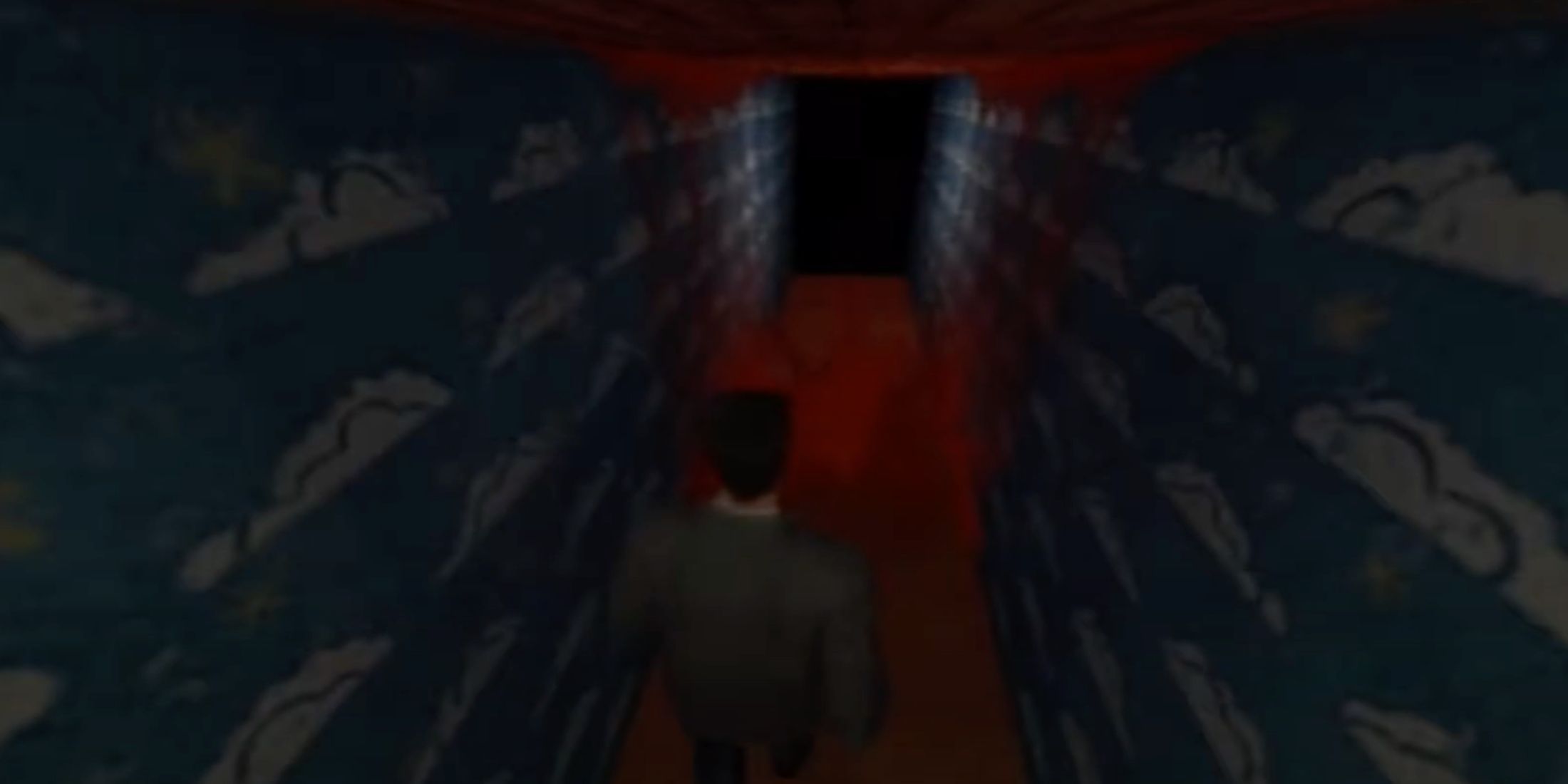 Max Payne walking through a corridor with a blood splatter on the floor