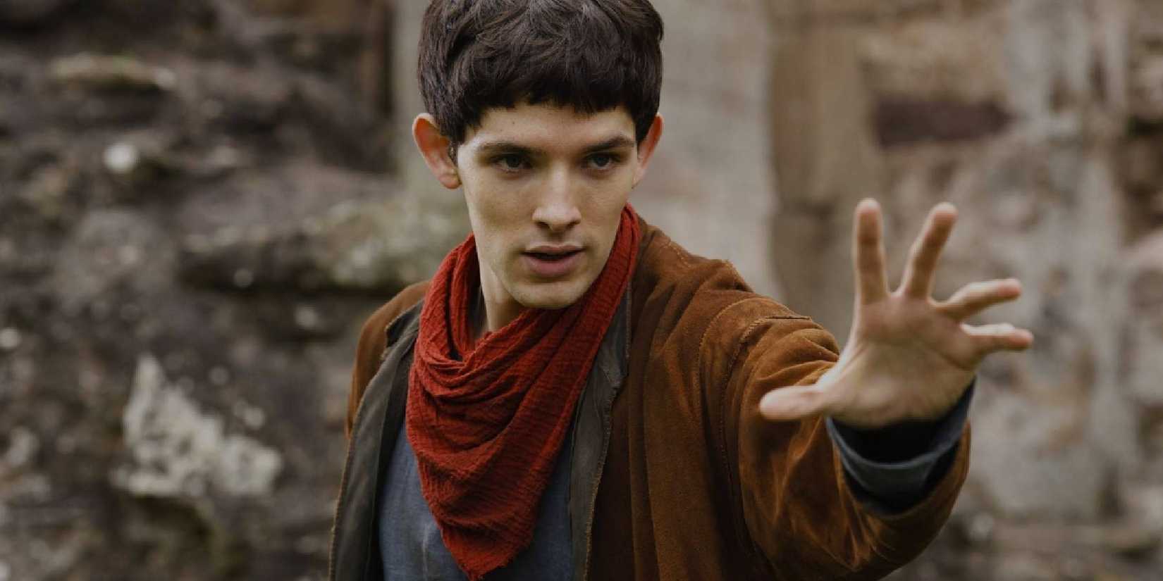Merlin holding his hand up, preparing a spell