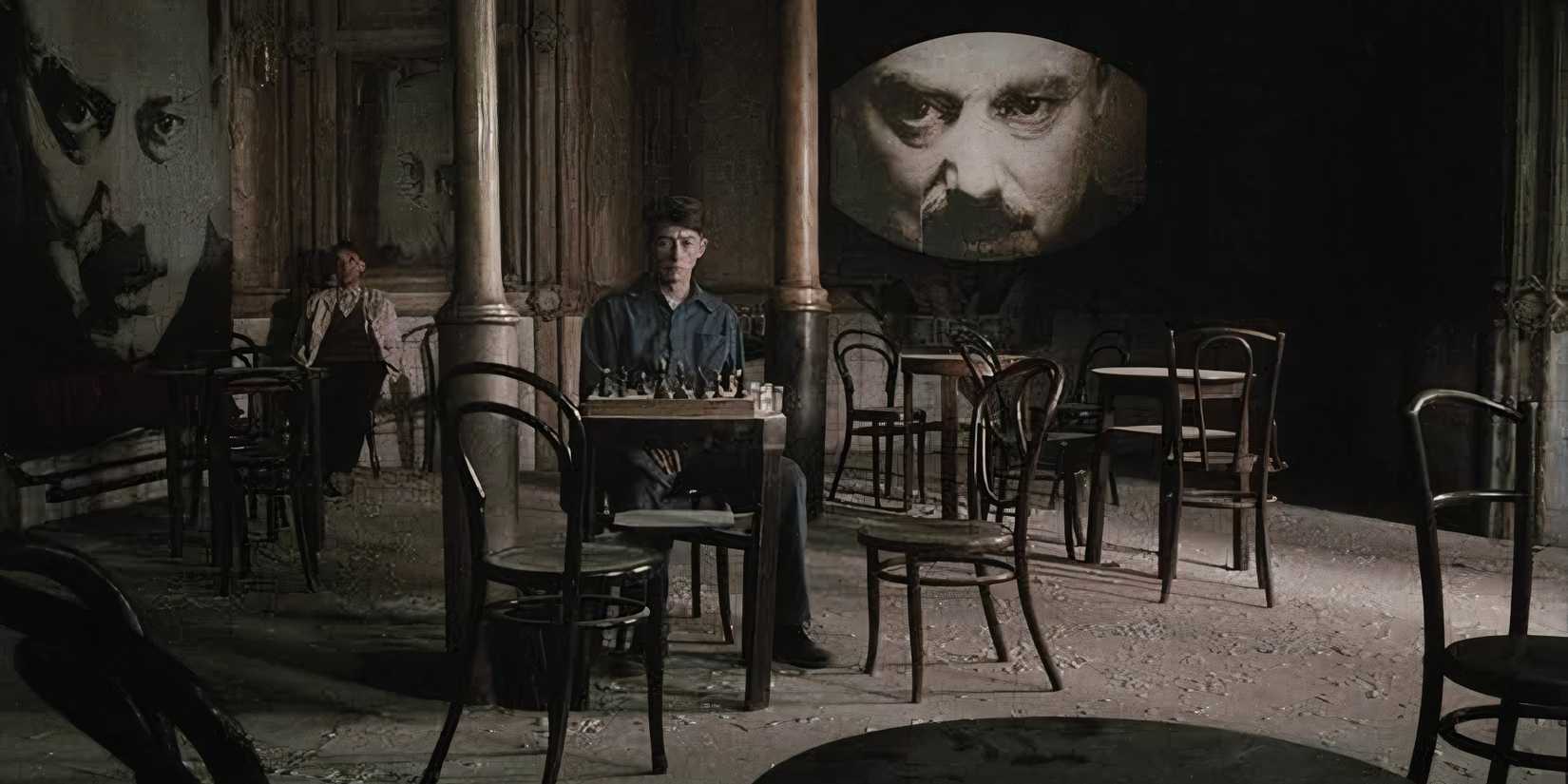 10 Movies Warhammer 40k Fans Should Watch  John Hurty sits in a cafe while Big Brother watches