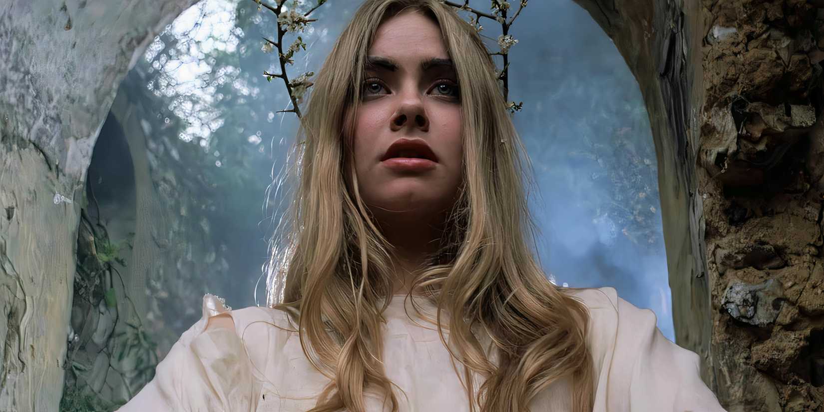 10 Best British Horror Movies of All Time Girl wearing white robes and thorns
