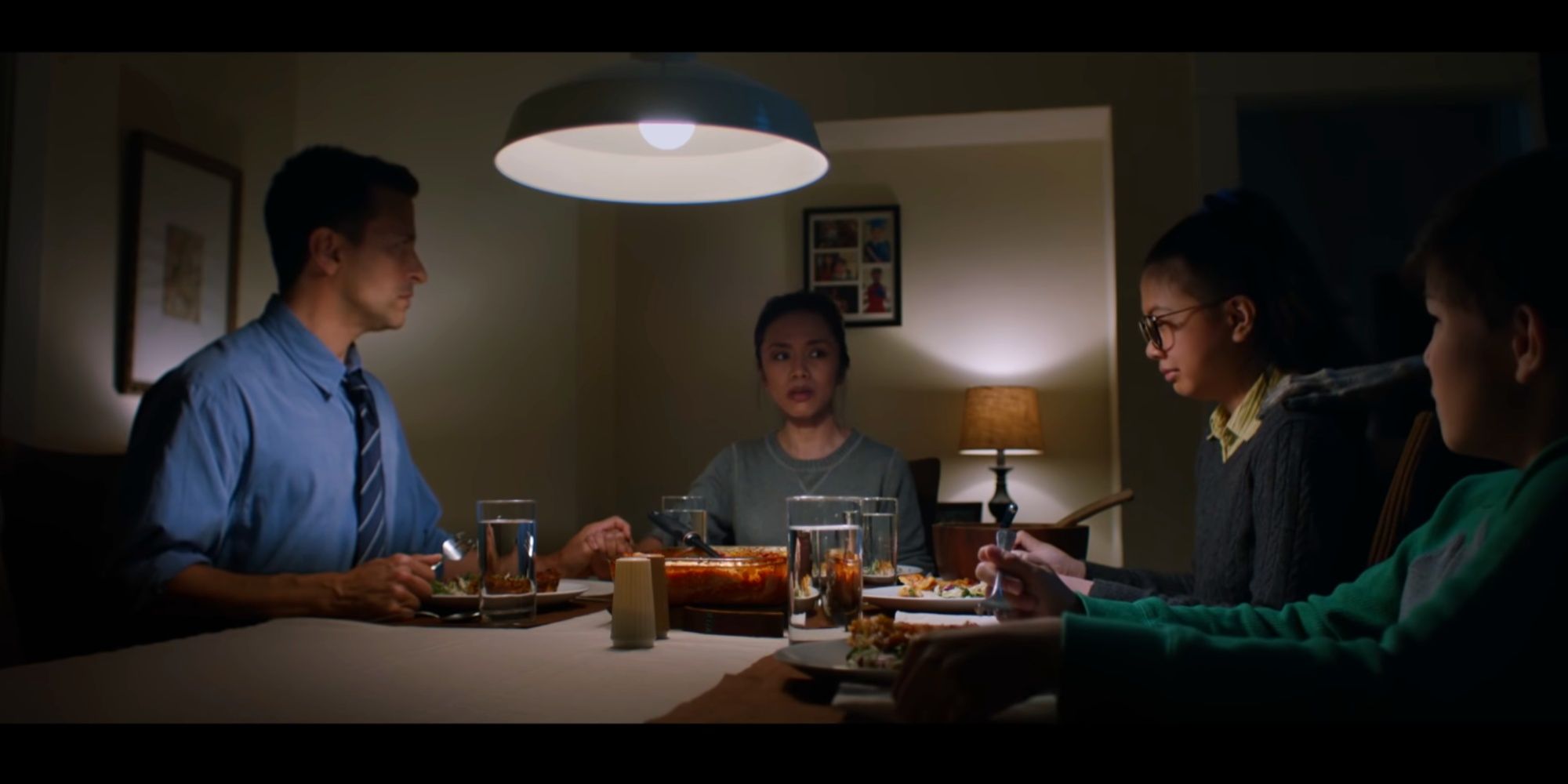 Ignore It (short film) - family eating dinner monster hand on shoulder