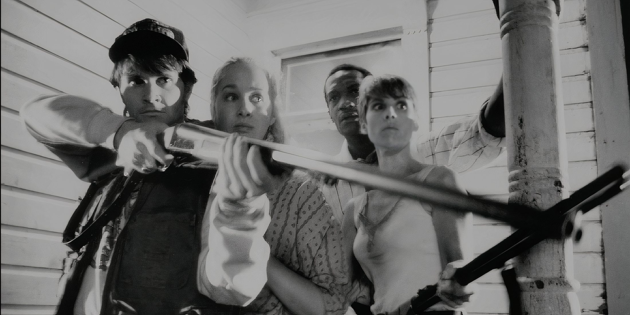 All survivors standing on the porch with guns in Night of the Living Dead