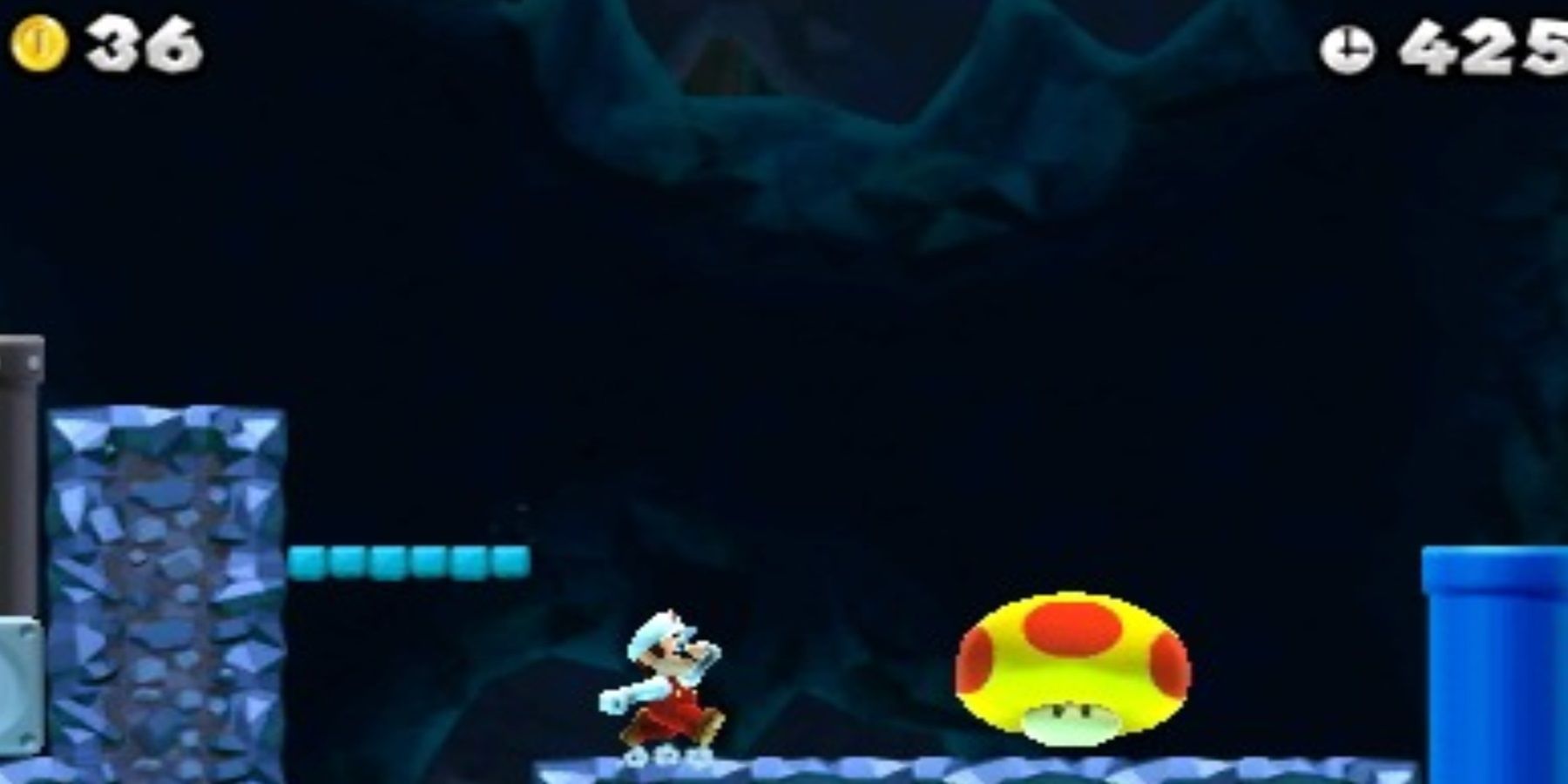 mario running towards a mushroom