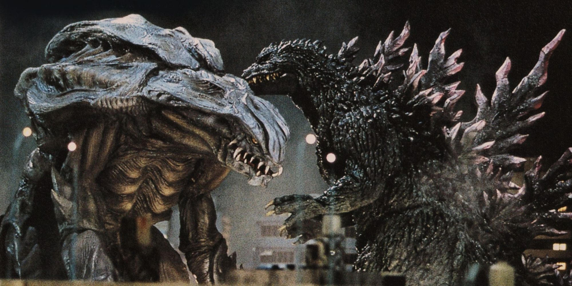 Promotional image of Godzilla 2000 fighting Orga.