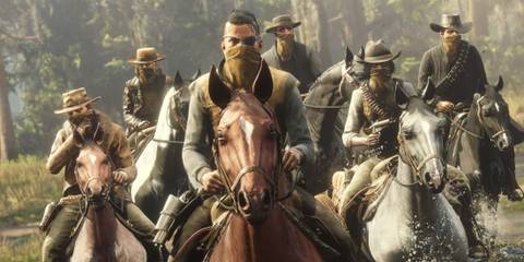 Group of masked outlaws riding horses through water in Red Dead Online