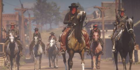 A group of masked outlaws on horseback rides in Red Dead Online
