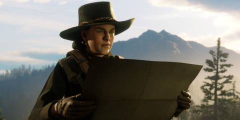 Outlaw in Western attire examines a map in the wilderness in Red Dead Online