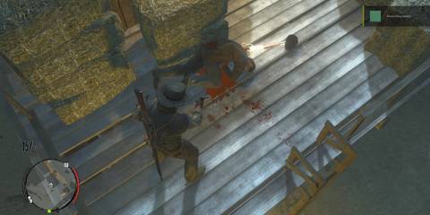 John Marston hovering over a corpse and aiming his gun down in Red Dead Redemption