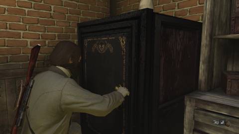Image showing John Marston cracking safe at the Armadillo bank in Red Dead Redemption.