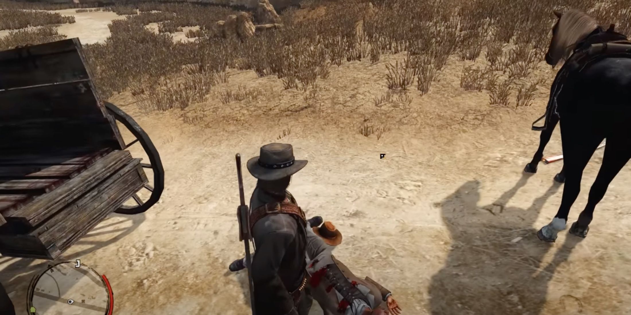 John standing over a corpse about to loot it in Red Dead Redemption