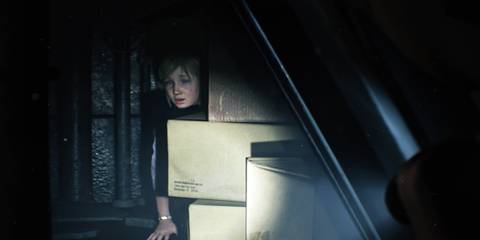 Young Sherry hiding behind a stack of boxes in Resident Evil 2