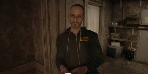 Resident Evil 7 standing next to archway holding his phone