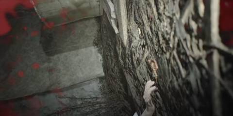 Half of Ethan Winters' body lying on the ground in Marguerite Baker's lair