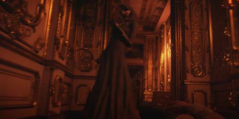 Cassandra Dimitrescu standing over Ethan Winters' dead body in Resident Evil Village