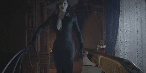 Lady Dimitrescu wearing Maggie Robertson's black dress and wielding her claws