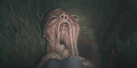 A mutant baby putting Ethan's legs in its mouth